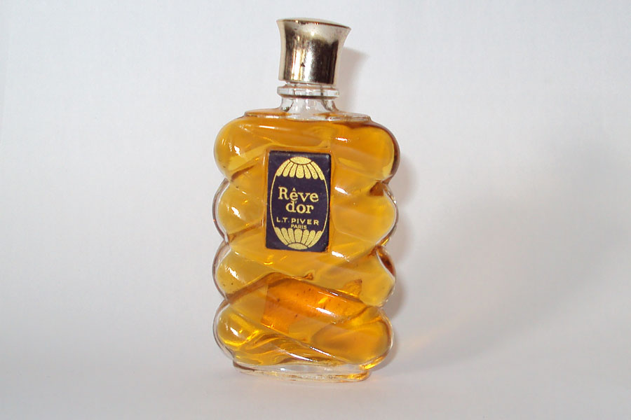 Rêve D'Or au dos etiquette du parfumeur à HUY (39) Hauteur 8.7 cm plein de Pivert 