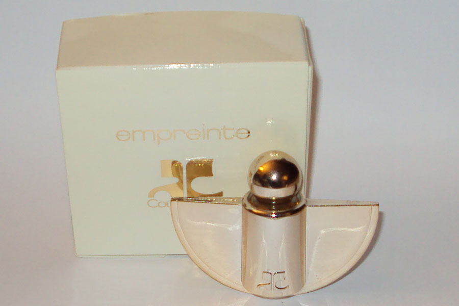 Empreinte Bijou parfum broche en plastique doré contenant la mini de l'eau de toilette 5 ml de Courrèges 